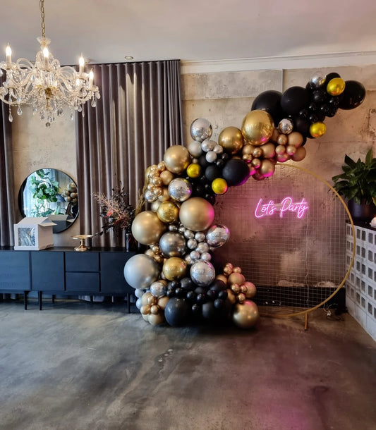 A stunning Black Gold and Silver Balloon Garland + Easel, Neon & Table