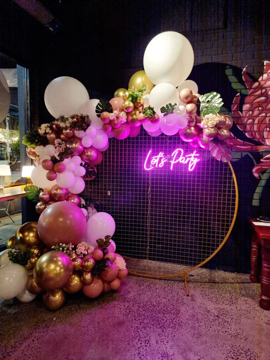 Living in Luxury with a Floral Balloon Garland + Neon Sign