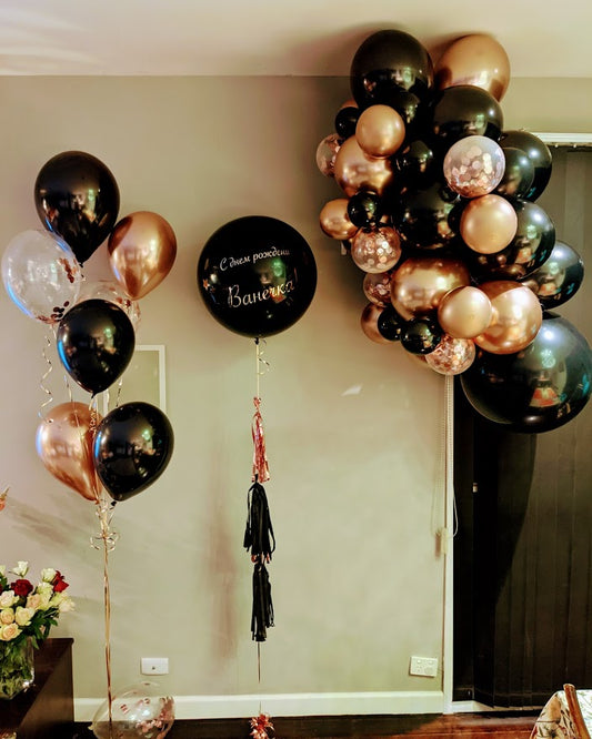 Creating Epic Experiences: A Black & Gold Balloon Garland